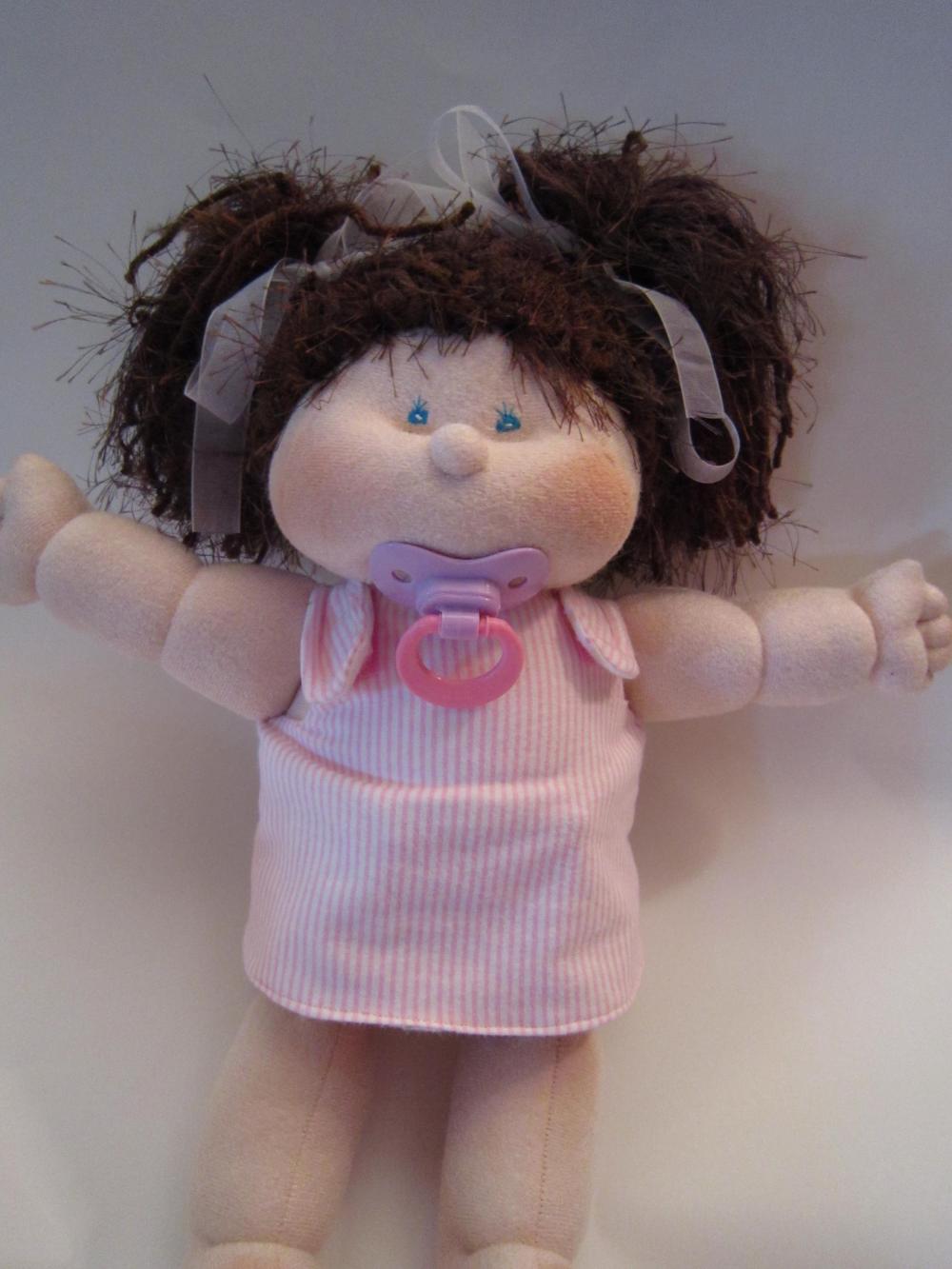 soft doll with magnetic pacifier